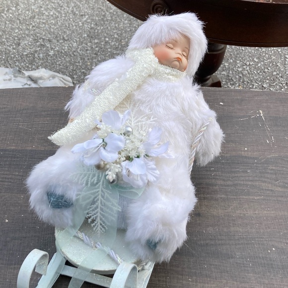 Snowy Porcelain Baby on a Sleigh - Picture 2 of 6